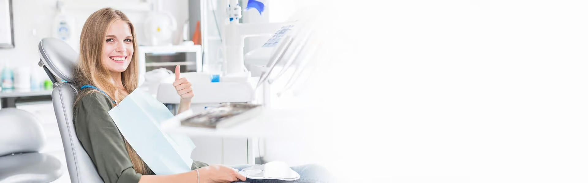 The image shows a woman sitting at a dental chair with her mouth open, seemingly ready for a dental appointment, with a focus on dental equipment and tools behind her.